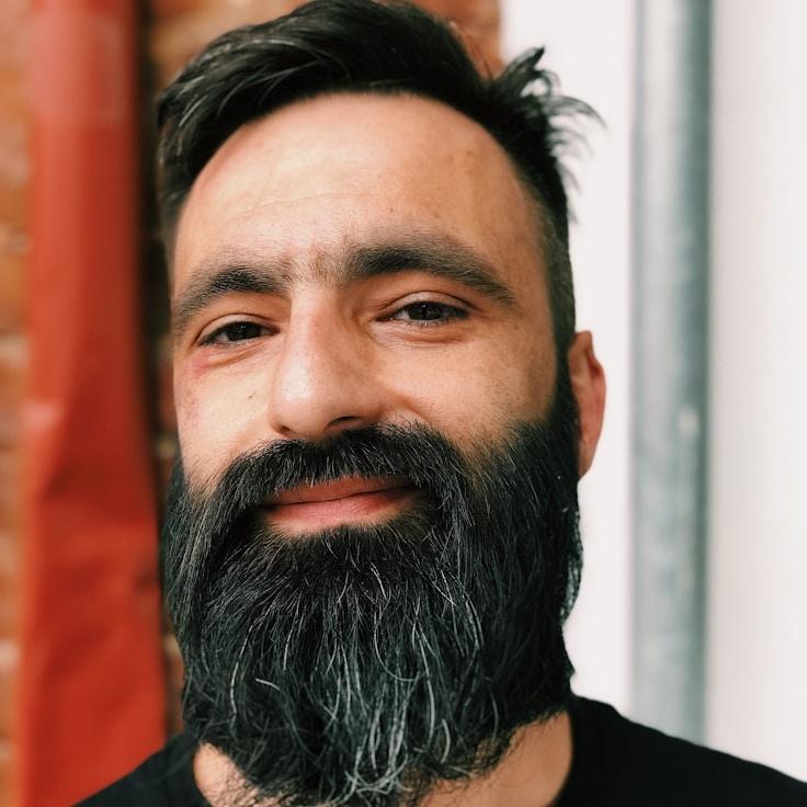 Kaveri Mehta, Lead Design Curator at CloudSkyBreeze, reviewing corporate floral arrangements